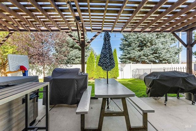 view of patio featuring fence, area for grilling, and a pergola