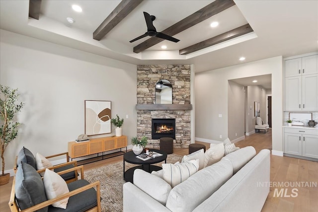 11966 W Zamalek Ct, Kuna, ID 83634 - living area with ceiling fan, light wood-style floors, recessed lighting, a fireplace, and beamed ceiling
