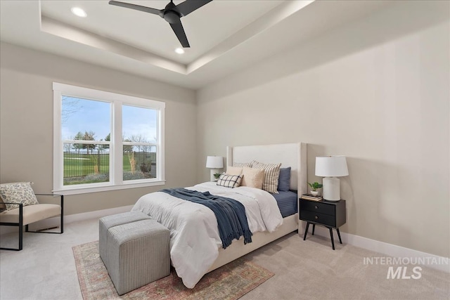 11966 W Zamalek Ct, Kuna, ID 83634 - bedroom featuring carpet flooring, recessed lighting, a tray ceiling, and ceiling fan