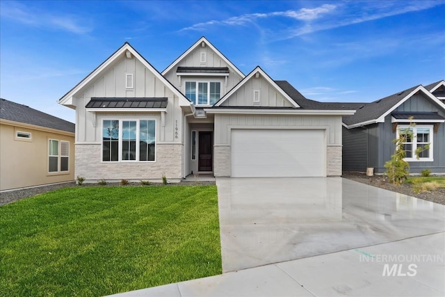 11966 W Zamalek Ct, Kuna, ID 83634 - view of front of home with board and batten siding, concrete driveway, a garage, a front yard, and a standing seam roof
