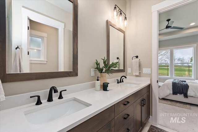 11966 W Zamalek Ct, Kuna, ID 83634 - bathroom featuring double vanity, plenty of natural light, and ensuite bathroom
