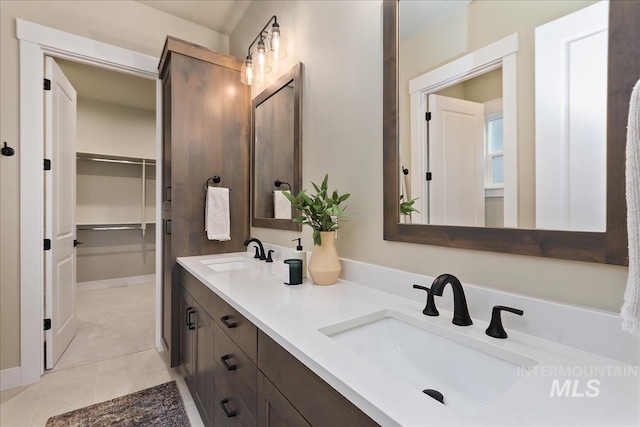 11966 W Zamalek Ct, Kuna, ID 83634 - bathroom featuring double vanity, tile patterned floors, and a spacious closet