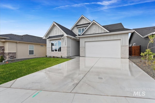 11966 W Zamalek Ct, Kuna, ID 83634 - view of front of property featuring board and batten siding, driveway, and a garage