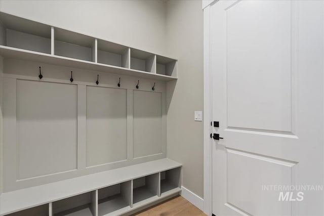 11966 W Zamalek Ct, Kuna, ID 83634 - mudroom with baseboards and wood finished floors