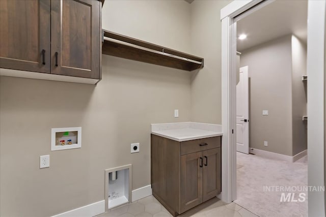11966 W Zamalek Ct, Kuna, ID 83634 - washroom with hookup for an electric dryer, washer hookup, cabinet space, light tile patterned floors, and light carpet
