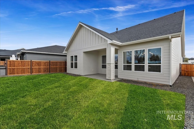 11966 W Zamalek Ct, Kuna, ID 83634 - rear view of property featuring board and batten siding, a fenced backyard, a patio, and a shingled roof