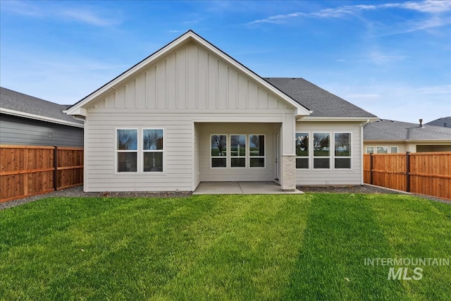 11966 W Zamalek Ct, Kuna, ID 83634 - rear view of house featuring board and batten siding, a fenced backyard, and a patio area