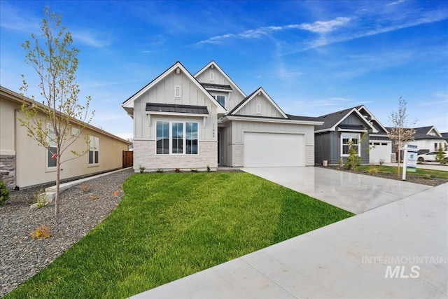 11966 W Zamalek Ct, Kuna, ID 83634 - view of front of house featuring board and batten siding, driveway, a front yard, and a garage