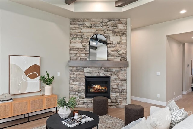 11966 W Zamalek Ct, Kuna, ID 83634 - living area with wood finished floors, a stone fireplace, and recessed lighting