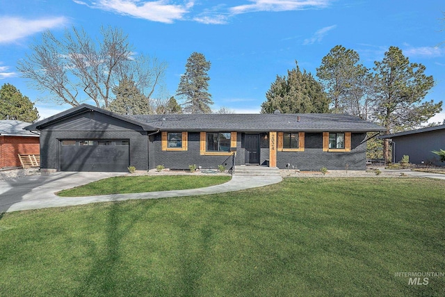 view of front of home featuring brick siding, concrete driveway, a front yard, and an attached garage