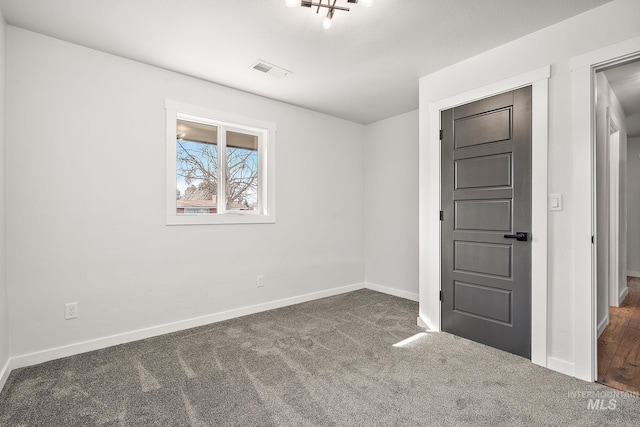 unfurnished bedroom with carpet and baseboards