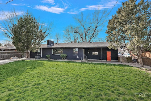 rear view of house with a patio and cooling unit