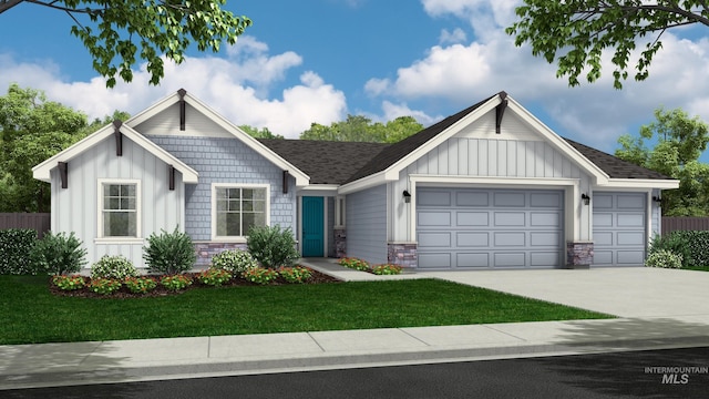 view of front of property with a garage and a front yard