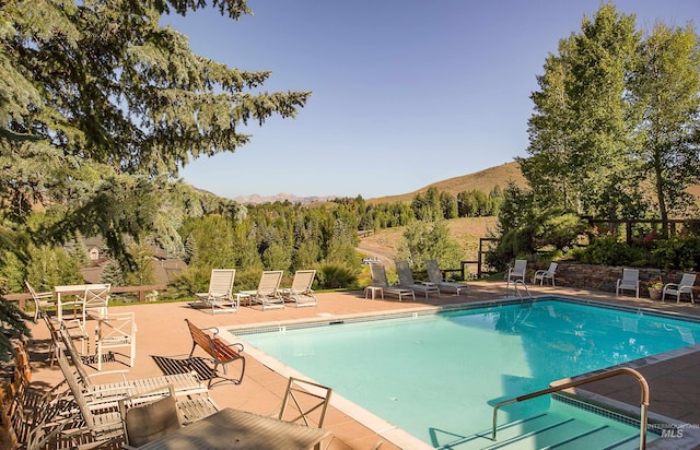 4139 Bluff Condo Dr, Sun Valley, ID 83353 - community pool featuring a mountain view and a patio