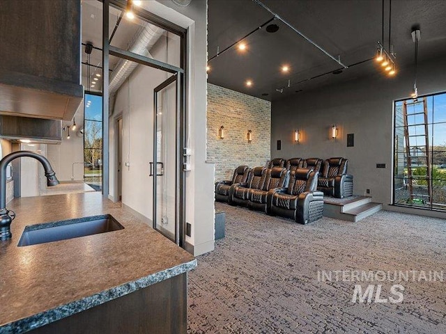 home theater room featuring a sink and french doors