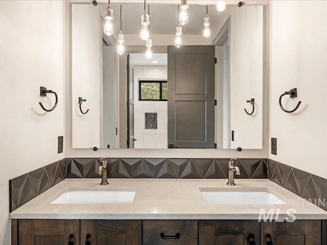 bathroom featuring double vanity and a sink