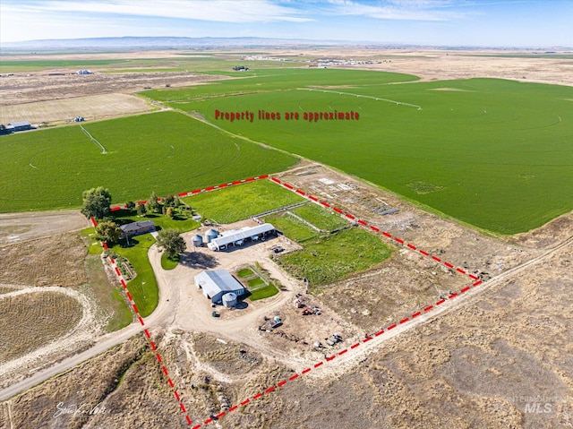 birds eye view of property featuring a rural view