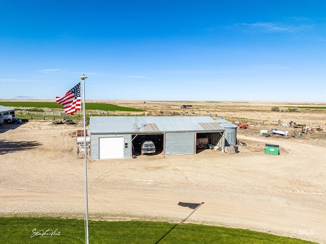 view of outbuilding with a rural view