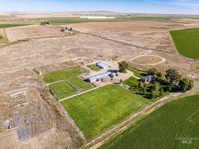 birds eye view of property with a rural view