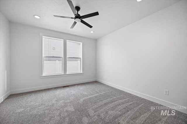 carpeted spare room with baseboards, recessed lighting, and ceiling fan