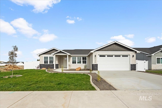 single story home featuring stone siding, a garage, concrete driveway, and a gate