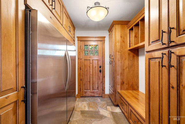 mudroom with light tile patterned floors