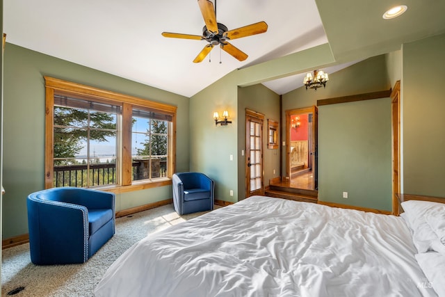 carpeted bedroom featuring ceiling fan with notable chandelier and vaulted ceiling