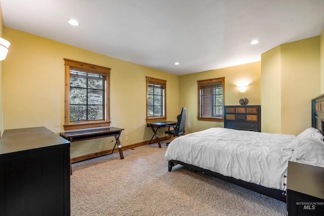 bedroom with light carpet