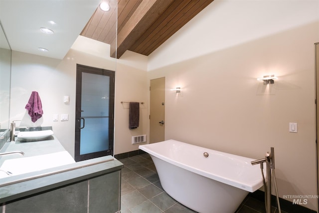 1115 Heavens Gate Ct, Mccall, ID 83638 - bathroom featuring a freestanding bath, double vanity, wooden ceiling, a shower with shower door, and tile patterned flooring