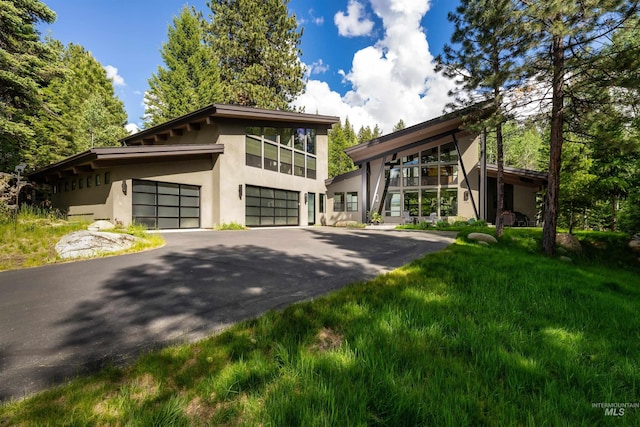 1115 Heavens Gate Ct, Mccall, ID 83638 - contemporary house featuring stucco siding and driveway