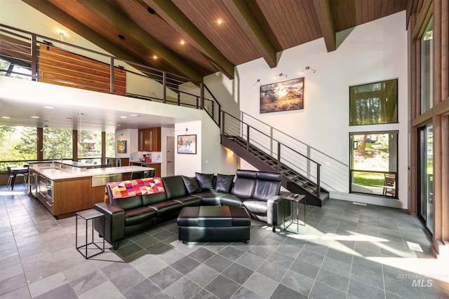 1115 Heavens Gate Ct, Mccall, ID 83638 - common area featuring a towering ceiling, a sink, stairway, beam ceiling, and recessed lighting