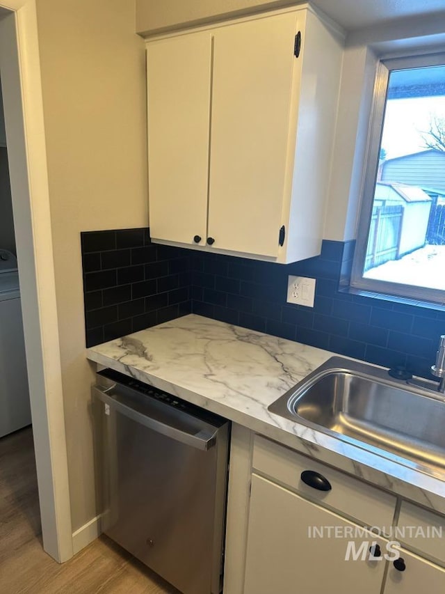 3109 N Tamarack Dr, Boise, ID 83703 - kitchen featuring a sink, backsplash, white cabinets, and dishwasher