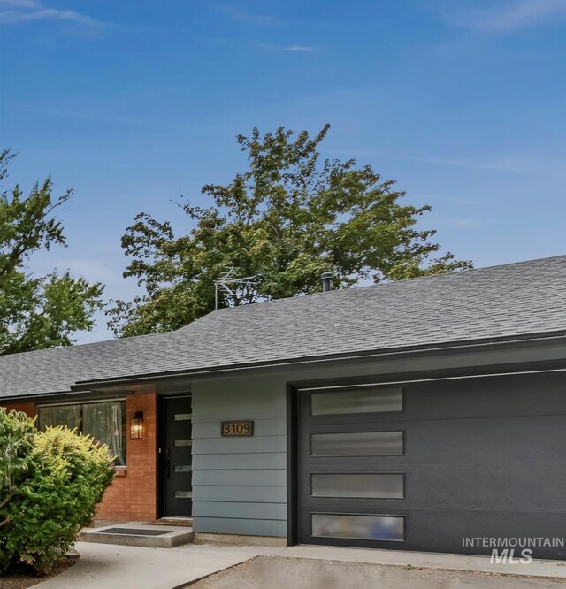 3109 N Tamarack Dr, Boise, ID 83703 - view of front of house with an attached garage and a shingled roof