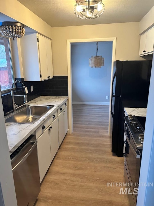 3109 N Tamarack Dr, Boise, ID 83703 - kitchen with a sink, light wood-type flooring, white cabinets, and appliances with stainless steel finishes