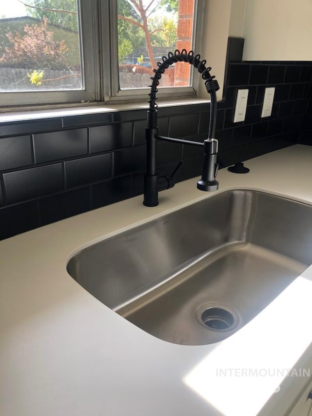 3109 N Tamarack Dr, Boise, ID 83703 - interior details with light countertops, decorative backsplash, and a sink