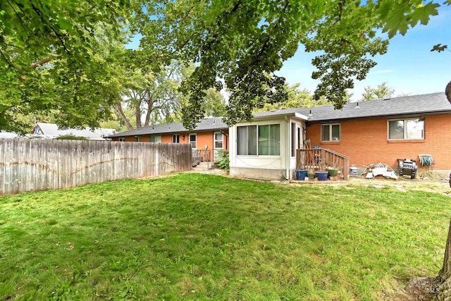 3109 N Tamarack Dr, Boise, ID 83703 - back of house with brick siding, fence, and a lawn