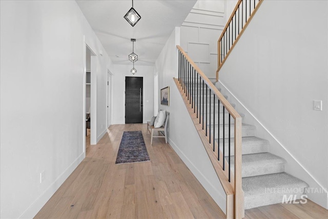 13625 Hickory Rnch, Nampa, ID 83651 - foyer with stairway, wood finished floors, and baseboards
