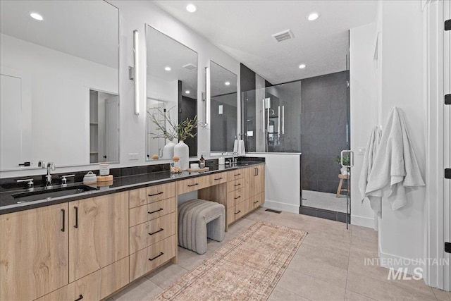 13625 Hickory Rnch, Nampa, ID 83651 - bathroom featuring double vanity, walk in shower, recessed lighting, and tile patterned flooring