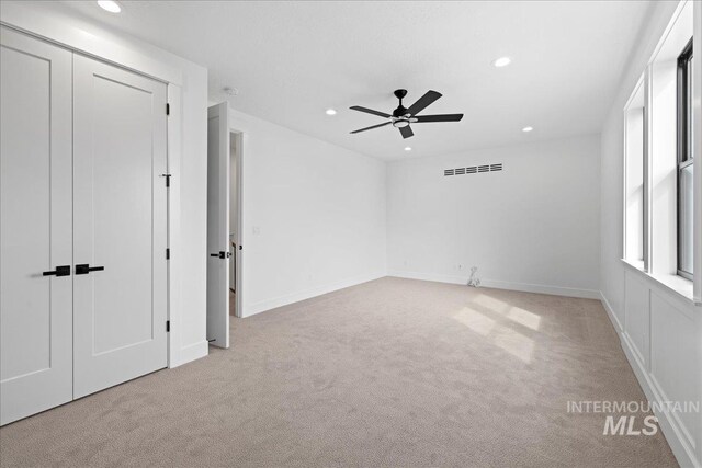 13625 Hickory Rnch, Nampa, ID 83651 - unfurnished bedroom featuring light colored carpet, recessed lighting, baseboards, ceiling fan, and a closet
