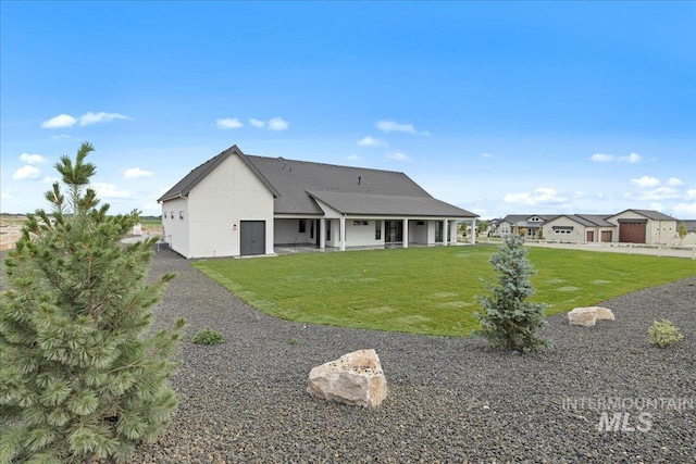 13625 Hickory Rnch, Nampa, ID 83651 - back of house featuring a lawn