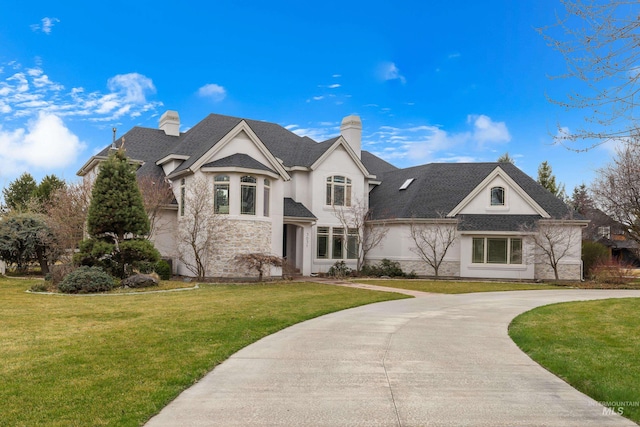 3031 Champagne Ct, Eagle, ID 83616 - french country inspired facade featuring stone siding, stucco siding, a front yard, a chimney, and curved driveway