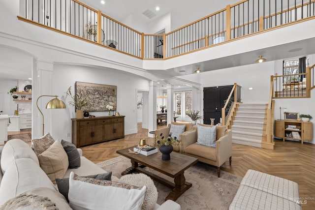 3031 Champagne Ct, Eagle, ID 83616 - living area with recessed lighting, baseboards, stairs, ornate columns, and a high ceiling