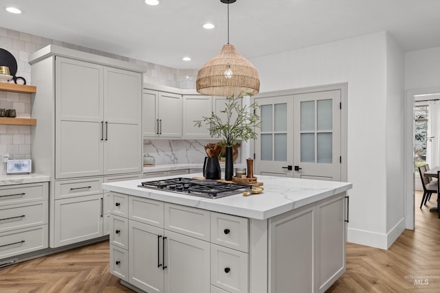 3031 Champagne Ct, Eagle, ID 83616 - kitchen with open shelves, backsplash, stainless steel gas stovetop, and recessed lighting