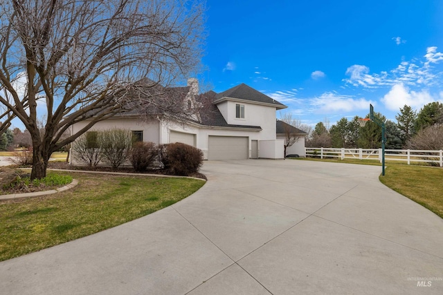 3031 Champagne Ct, Eagle, ID 83616 - view of property exterior featuring fence, driveway, a yard, a garage, and stucco siding