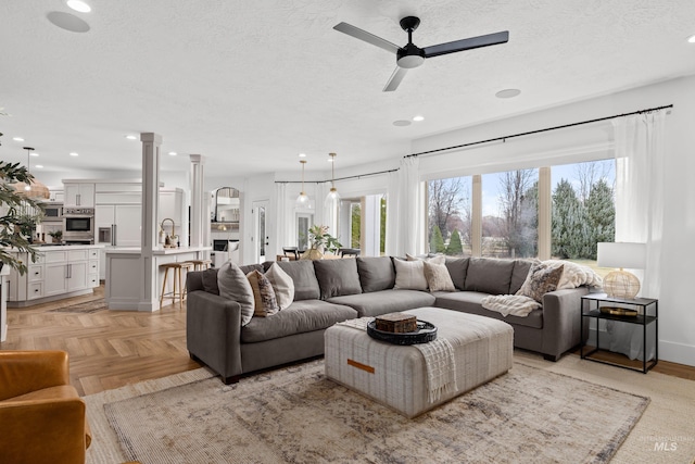 3031 Champagne Ct, Eagle, ID 83616 - living area with a textured ceiling, a ceiling fan, and recessed lighting