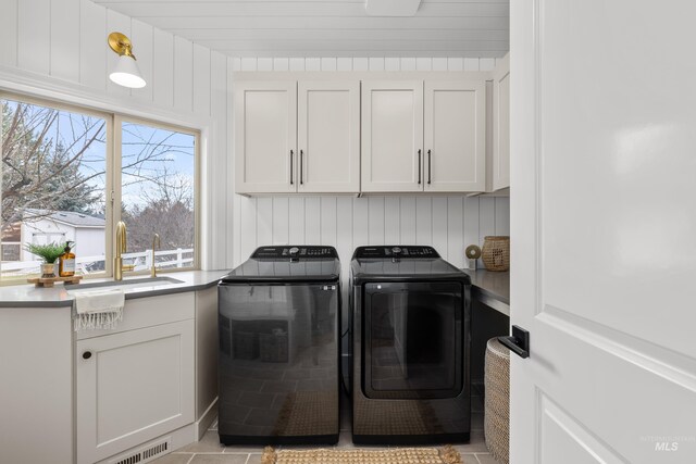 3031 Champagne Ct, Eagle, ID 83616 - washroom with washer and dryer, cabinet space, visible vents, and a sink