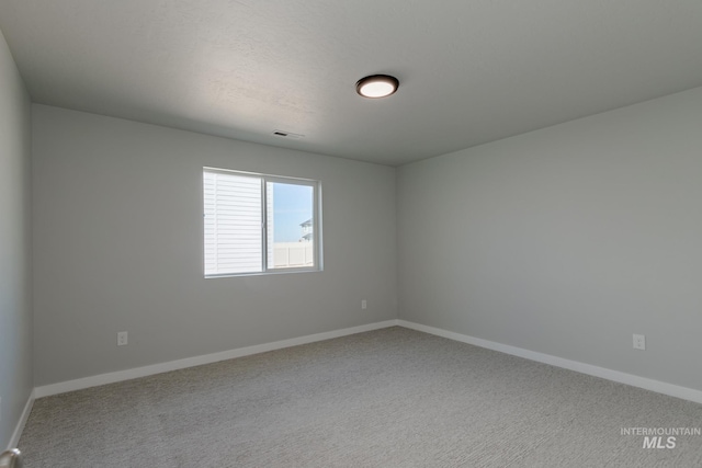 unfurnished room featuring carpet floors