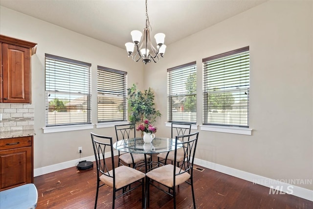 730 N Finsbury Way, Star, ID 83669 - dining area with dark wood-type flooring and a chandelier