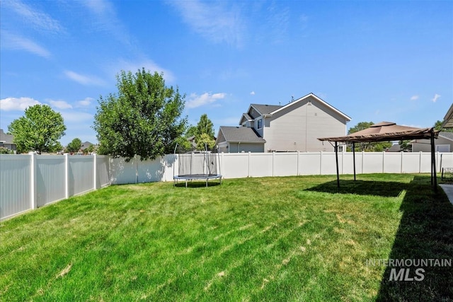 730 N Finsbury Way, Star, ID 83669 - fenced backyard featuring a trampoline and a gazebo
