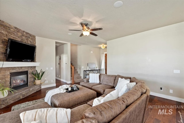 730 N Finsbury Way, Star, ID 83669 - living area with ceiling fan, a stone fireplace, wood finished floors, and stairway